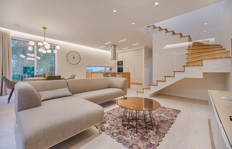 Finished living room with warm hardwood-style flooring